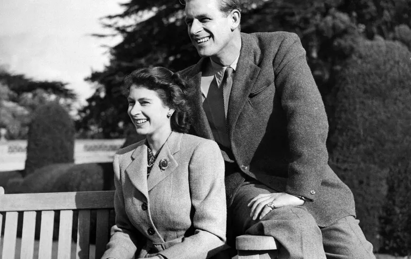 Britain's Princess Elizabeth (future Queen Elizabeth II) and her husband Philip, Duke of Edinburgh, pose during their honeymoon, November 25, 1947 in Broadlands estate, Hampshire. (Photo by - / - / AFP)