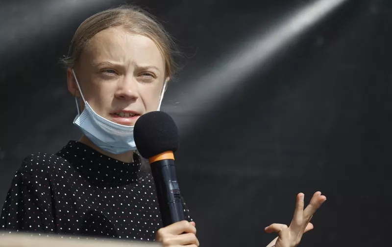 Swedish founder of the "School Strike for Climate" movement Greta Thunberg speaks on the sidelines of talks between representatives of the movement and German Chancellor in Berlin on August 20, 2020. (Photo by Odd ANDERSEN / AFP)