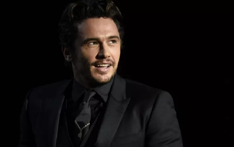 US actor and director James Franco smiles after receiving the "Concha de Oro" (Golden Shell) best film award for the film "The Disaster artist" during the 65th San Sebastian Film Festival closing ceremony in the northern Spanish Basque city of San Sebastian on September 30, 2017. / AFP PHOTO / ANDER GILLENEA