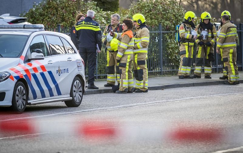 Emergency services stand outside a postal sorting company after a bomb letter is believed to have detonated in the mail room in the southern city of Kerkrade on February 12, 2020. - A suspected blackmailer believed to have sent two letter bombs which exploded at offices in the Netherlands on February 12 has demanded payment in bitcoins, Dutch police said. (Photo by Marcel VAN HOORN / ANP / AFP) / Netherlands OUT