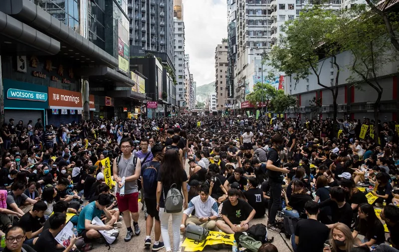 Protesters gather in Mong Kok during a general strike in Hong Kong on August 5, 2019, as simultaneous rallies were held across seven districts. - Hong Kong's pro-democracy protesters are close to creating a "very dangerous situation", the city's leader warned on August 5 as train travel and international flights in the global financial hub were thrown into chaos. (Photo by Isaac Lawrence / AFP)