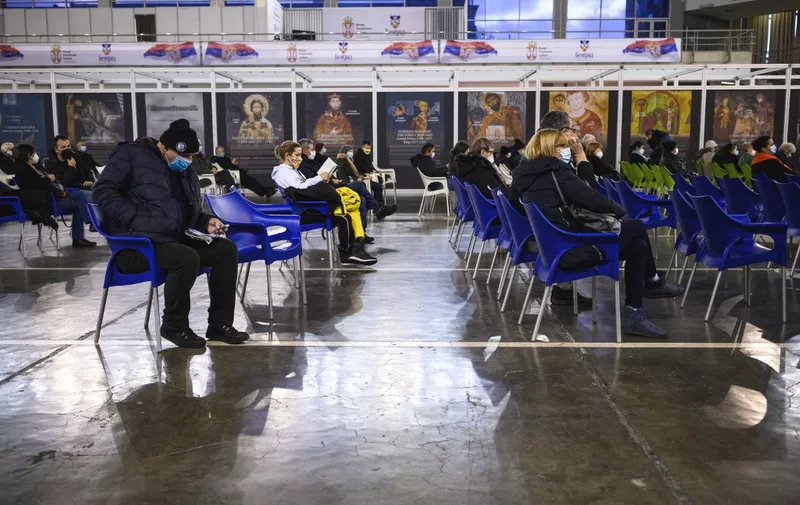 People rest and are watched to control possible side effects after receiving a dose of a Covid-19 vaccine in the Belgrade Fair turned into a vaccination centre on February 12, 2021. - Inside the dome of Belgrade's fairgrounds, dozens of nurses in protective suits inject Covid-19 jabs into young and old alike, working with an efficiency that has turned Serbia into continental Europe's fastest vaccinator. The small Balkan country has inoculated more than 500,000 of its seven million population in almost two weeks, a rate that exceeds all countries in Europe outside the United Kingdom, according to the scientific publication Our World in Data. (Photo by Andrej ISAKOVIC / AFP)