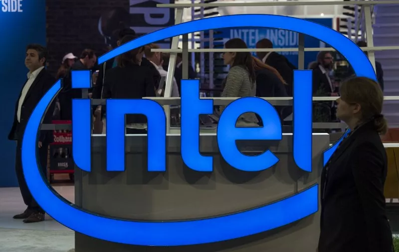 (FILES) This file photo taken on March 15, 2016 shows the logo of US semi-conductor giant at the Digital Business fair CEBIT in Hanover, Germany.
US tech giant Intel announced plans April 19, 2016 to cut up to 12,000 jobs as it seeks to reorient its business to reduce dependence on the slumping personal computer market. The restructuring will eliminate about 11 percent of the workforce by mid-2017 and aims to "accelerate evolution from a PC company to one that powers the cloud and billions of smart, connected computing devices," the California group said in a statement.
 / AFP PHOTO / John MACDOUGALL