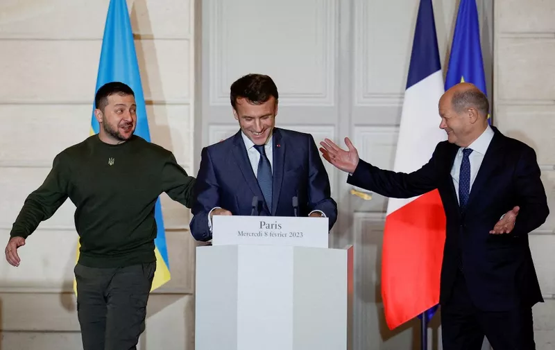 France's President Emmanuel Macron (C), Ukraine's President Volodymyr Zelensky (L) and Germany's Chancellor Olaf Scholz react during a joint statement at the presidential Elysee Palace in Paris, on February 8, 2023. (Photo by SARAH MEYSSONNIER / POOL / AFP)