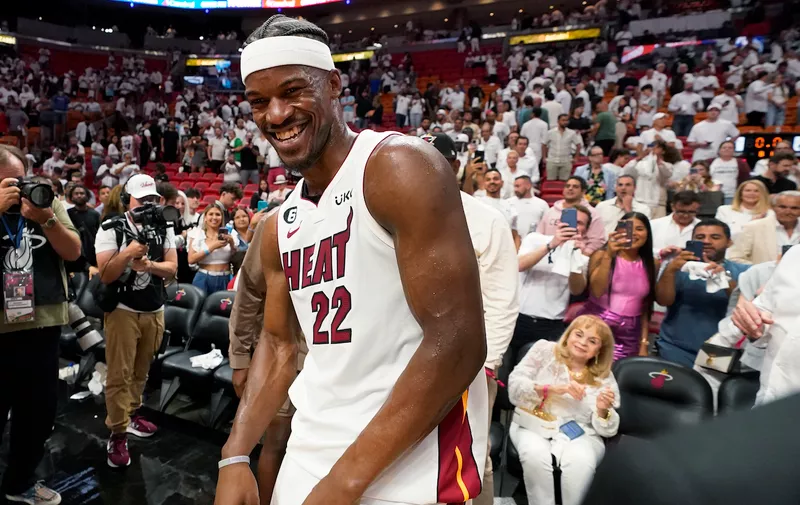 Miami Heat forward Jimmy Butler (22) reacts after the Heat beat the New York Knicks 96-92 during the second half of Game 6 of an NBA basketball second-round playoff series, Friday, May 12, 2023, in Miami. (AP Photo/Wilfredo Lee)