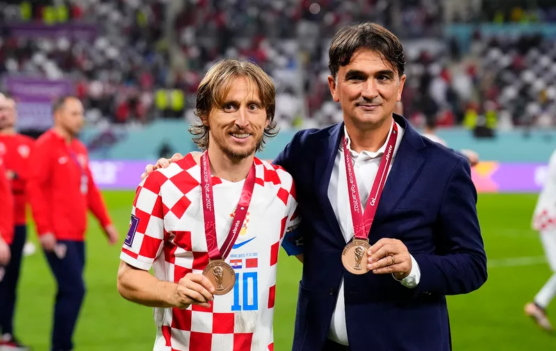 Croatia's head coach Zlatko Dalic, right, and Croatia's Luka Modric pose for photos after their win in the World Cup third-place playoff soccer match against Morocco at Khalifa International Stadium in Doha, Qatar, Saturday, Dec. 17, 2022. (AP Photo/Hassan Ammar)