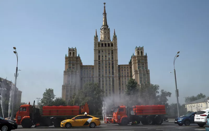 MOSCOW, RUSSIA – JUNE 22, 2021: Utility service vehicles spray water in Sadovoye Koltso [Garden Ring] Street to protect the road surface from overheating as a heatwave hits Moscow. Pictured in the back is Kudrinskaya Square residential building. Mikhail Tereshchenko/TASS,Image: 617131648, License: Rights-managed, Restrictions: , Model Release: no, Credit line: Profimedia