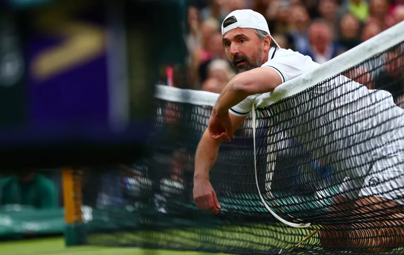 LONDON, ENGLAND - MAY 19:   Goran Ivanisevic of Croatia collapses on the net during his men's doubles match between Jamie Murray of Great Britain and Goran Ivanisevic of Croatia and Lleyton Hewitt of Australia and Pat Cash of Australia during the Wimbledon No. 1 Court Celebration in support of the Wimbledon Foundation at All England Lawn Tennis and Croquet Club on May 19, 2019 in London, England. (Photo by Dan Istitene/Getty Images)
