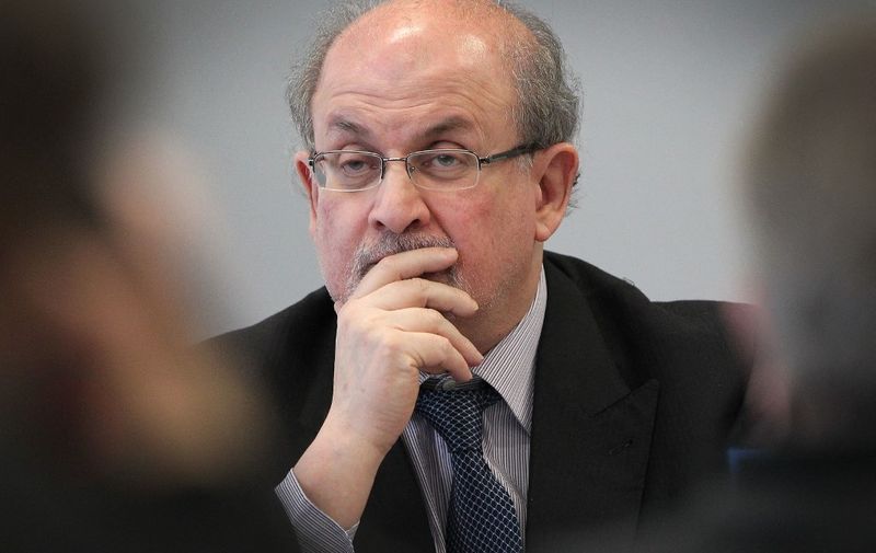 Indian born British writer Salman Rushdie is seen during the opening press conference of the Frankfurt Book Fair in Frankfurt am Main, western Germany, on October 13, 2015. Rushdie, subject to an Iranian fatwa calling for his killing over his 1989 book "The Satanic Verses", attends the opening ceremony of the fair, boycotted this year by Tehran . 
AFP PHOTO / DANIEL ROLAND (Photo by DANIEL ROLAND / AFP)