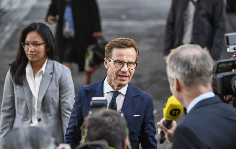 Ulf Kristersson, leader of the Moderate Party in Sweden speaks to the press upon arrival for the opening of the Swedish Parliament Riksdagen on September 25, 2018 in Stockholm. - Sweden's centre-right opposition and the far-right ousted Swedish Prime Minister Stefan Löfven in a vote of no-confidence as expected after September 9 elections left neither the left or right bloc with a majority. A total of 204 of 349 members of parliament voted against Lofven, while 142 voted in favour of him. (Photo by Jonathan NACKSTRAND / AFP)