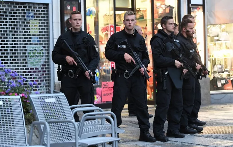Police secures the area naer Stachus square following shooting earlier at a shooping mall on July 22, 2016 in Munich.
Several people were killed on Friday in a shooting rampage by a lone gunman in a Munich shopping centre, media reports said / AFP PHOTO / dpa / Sven Hoppe / Germany OUT