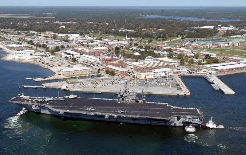 (FILES) This US Navy file handout photo shows the USS John F. Kennedy arriving at the Naval Air Station in Pensacola, Florida, on March 18, 2004. - US Media and US Navy are reporting an active shooter at the Air Station on December 6, 2019. there are reports of injuries. (Photo by PATRICK NICHOLS / US NAVY / AFP) / RESTRICTED TO EDITORIAL USE - MANDATORY CREDIT "AFP PHOTO / US NAVY / Patrick NICHOLS " - NO MARKETING - NO ADVERTISING CAMPAIGNS - DISTRIBUTED AS A SERVICE TO CLIENTS