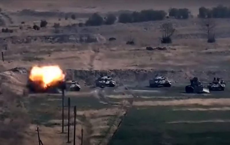 An image grab taken from a video made available on the official web site of the Armenian Defence Ministry on September 27, 2020, allegedly shows destroying of Azeri military vehicles during clashes between Armenian separatists and Azerbaijan in the breakaway region of Nagorno-Karabakh. (Photo by Handout / Armenian Defence Ministry / AFP) / RESTRICTED TO EDITORIAL USE - MANDATORY CREDIT "AFP PHOTO / Armenian Defence Ministry" - NO MARKETING NO ADVERTISING CAMPAIGNS - DISTRIBUTED AS A SERVICE TO CLIENTS --- NO ARCHIVE ---