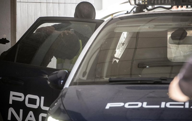 Spanish presumed drug trafficker Antonio Tejon, alias "El Castana", is taken into a police car to drive him to court in La Linea de la Concepcion on June 7, 2018. (Photo by Marcos Moreno / AFP)