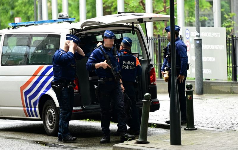 Belgian police stand guard outside, on the sideline of searches conducted at the European Parliament building as part of a Belgian probe into suspected Russian interference and corruption in Brussels on May 29, 2024. Investigators were searching the offices of an EU parliament staffer in Brussels and Strasbourg, as well as his Brussels home the state prosecutor's office said. (Photo by LAURIE DIEFFEMBACQ / Belga / AFP) / Belgium OUT