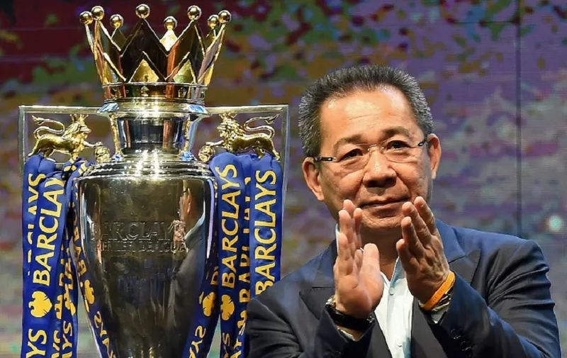 (FILES) In this file photo taken on May 18, 2016 Leicester City FC's owner Vichai Srivaddhanaprabha applauds as they take part in a presentation of the English Premier League football trophy at the King Power duty-free headquarters in Bangkok on May 18, 2016. - A helicopter belonging to Thai tycoon Vichai Srivaddhanaprabha crashed on October 27, 2018 near the stadium of his UK football club Leicester City. The identities of the pilot and any passengers on board have not yet been confirmed. It is also not yet known if anyone on the ground was injured. (Photo by CHRISTOPHE ARCHAMBAULT / AFP)