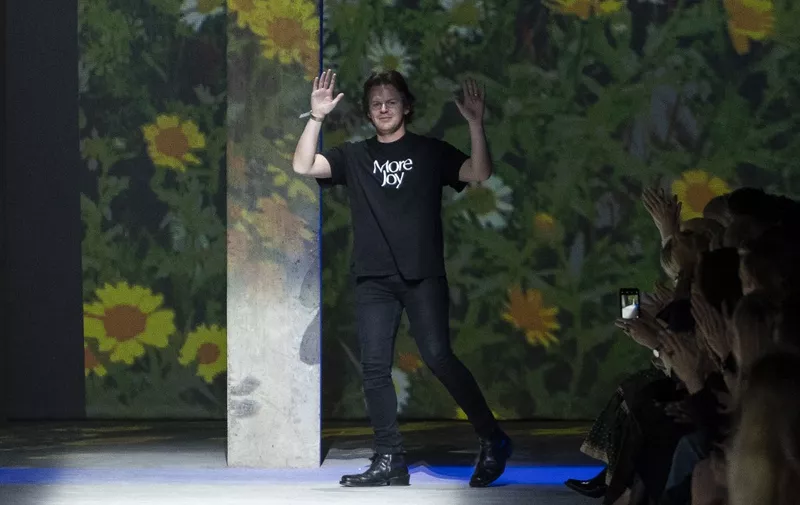 British designer Christopher Kane acknowledges the crowd after showcasing his designs for the Spring/Summer 2020 collection on the fourth day of London Fashion Week in London on September 16, 2019. (Photo by Niklas HALLE'N / AFP)