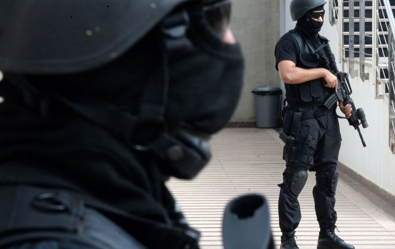 Members of the Moroccan special forces stand guard inside the Moroccan Central Bureau of Judicial Investigation (BCIJ) building during a press conference by the BCIJ's chief Abdelhak El Khayyam on September 14, 2015 in Rabat. Moroccan authorities said on September 14 that five alleged extremists have been arrested in the coastal city of Essaouira. AFP PHOTO / FADEL SENNA / AFP / FADEL SENNA