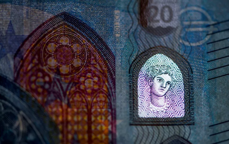 A picture taken on January 27, 2020 shows a detail of a twenty euros banknote in Dortmund, western Germany. (Photo by INA FASSBENDER / AFP)