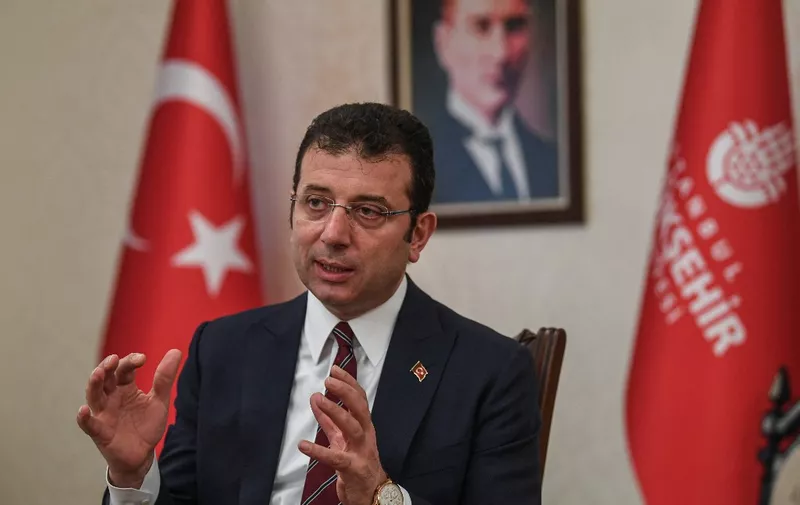 Mayor of Istanbul metropolitan municipality Ekrem Imamoglu speaks during an interview to AFP on April 2, 2020 in Istanbul, amid the spread of the epidemic COVID-19 coronavirus. - Istanbul's opposition mayor Ekrem Imamoglu on Thursday called for more robust action and a lockdown after Turkey's largest city reported the highest number of cases in the country. Without a strict lockdown, Imamoglu warned, even if 15 percent of the residents in Istanbul would move around rather than stay home, that would represent two million -- which amounts to the population of a big city in Europe. (Photo by Ozan KOSE / AFP)
