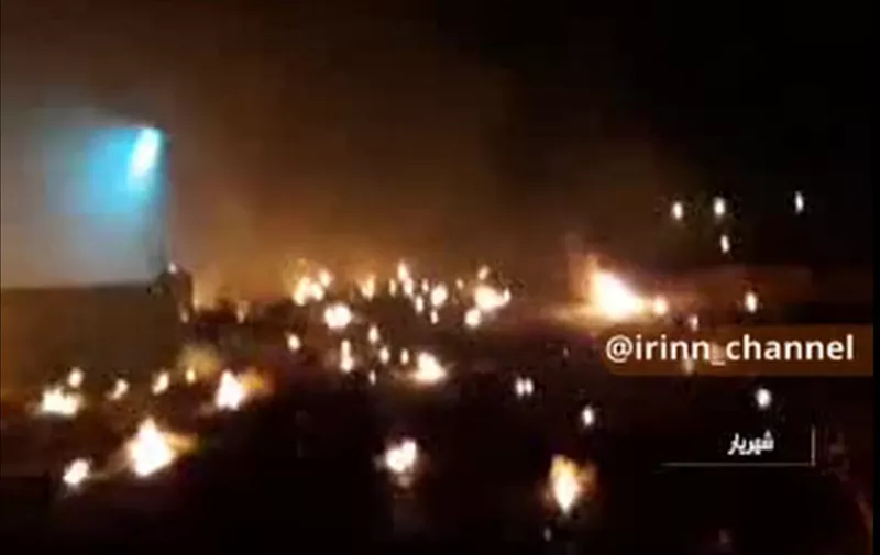 An image grab from footage obtained from Iranian State TV IRIB on January 8, 2020 shows burning debris at the site of a Ukrainian plane carrying at least 170 people that crashed shortly after take off early in the morning in Tehran killing everyone on board, according to Iran state media. - The Boeing 737 had left Tehran's international airport bound for Kiev, semi-official news agency ISNA said, adding that 10 ambulances were sent to the crash site. Press TV, state television's English-language news broadcaster, said the plane went down in the vicinity of Parand, a city in Tehran province. (Photo by - / IRINN / AFP) / RESTRICTED TO EDITORIAL USE - MANDATORY CREDIT - AFP PHOTO / HO / IRINN" NO MARKETING NO ADVERTISING CAMPAIGNS - DISTRIBUTED AS A SERVICE TO CLIENTS FROM ALTERNATIVE SOURCES, AFP IS NOT RESPONSIBLE FOR ANY DIGITAL ALTERATIONS TO THE PICTURE'S EDITORIAL CONTENT, DATE AND LOCATION WHICH CANNOT BE INDEPENDENTLY VERIFIED  - NO RESALE - NO ACCESS ISRAEL MEDIA/PERSIAN LANGUAGE TV STATIONS/ OUTSIDE IRAN/ STRICTLY NI ACCESS BBC PERSIAN/ VOA PERSIAN/ MANOTO-1 TV/ IRAN INTERNATIONAL /