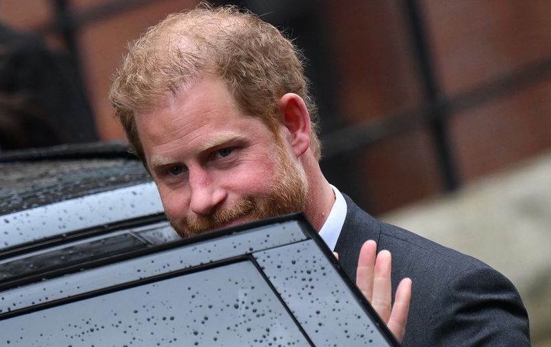 Britain's Prince Harry, Duke of Sussex gets in the car as he leaves the Royal Courts of Justice, Britain's High Court, in central London on March 28, 2023. - Prince Harry and pop superstar Elton John appeared at a London court, delivering a high-profile jolt to a privacy claim launched by celebrities and other figures against a newspaper publisher. The publisher of the Daily Mail, Associated Newspapers (ANL), is trying to end the high court claims brought over alleged unlawful activity at its titles. (Photo by Daniel LEAL / AFP)