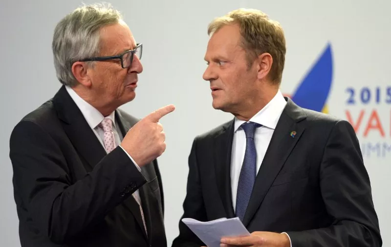 European Commission President Jean-Claude Juncker (L) speaks with European Council President Donald Tusk after a press conference following an Informal European Council meeting and a European Union - Africa Summit on Migration at the Mediterranean Conference Center, on November 12, 2015 in La Valletta. EU leaders attending a summit with their African counterparts today approved a 1.8-billion-euro trust fund for Africa aimed at tackling the root causes of mass migration to Europe.   AFP PHOTO / MATTHEW MIRABELLI  --- MALTA OUT