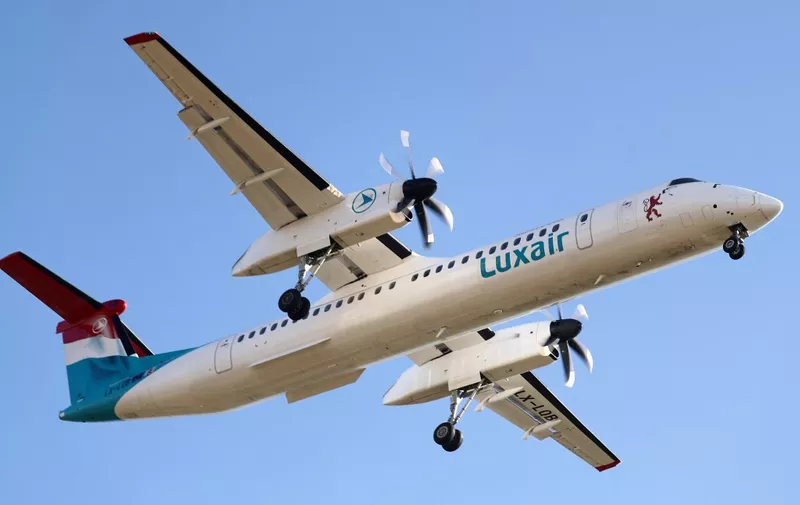 De Havilland Canada Dash 8-400 aircraft, of a Luxair company, getting ready to land at Barcelona airport, in Barcelona on January 2022. 
 -- (Photo by Urbanandsport/NurPhoto) (Photo by Joan Valls / NurPhoto / NurPhoto via AFP)