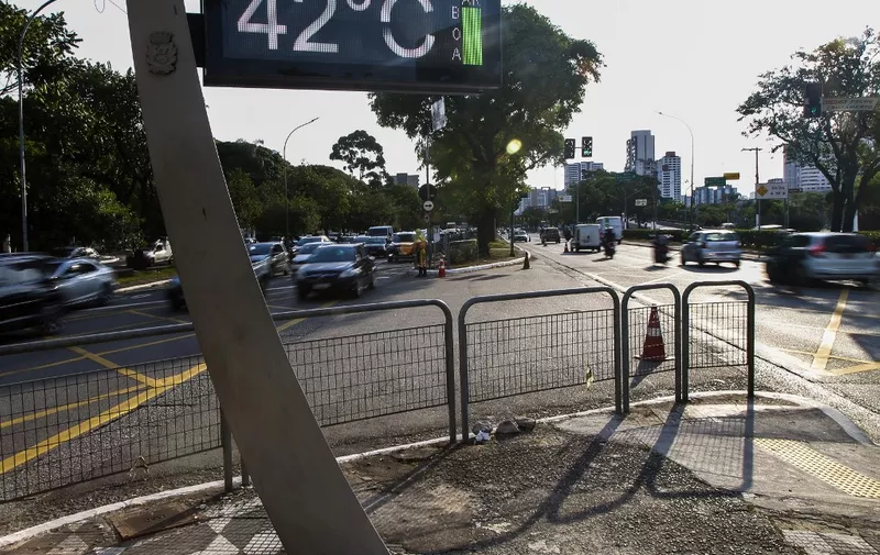 View of a street thermometer marking 42 degrees Celsius (107.6 F) in Sao Paulo city, Brazil on November 13, 2023. Much of Brazil is plunged into a heat wave in the middle of spring, with the highest temperatures of the year in Rio de Janeiro and Sao Paulo, officials said. (Photo by Miguel SCHINCARIOL / AFP)