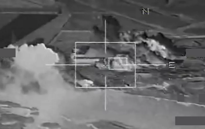 A grab image taken from a handout video released on November 17, 2015 by French Defense Audiovisual Communication and Production Unit (ECPAD) shows French warplanes bombing operational sites at the Islamic State's Syria stronghold Raqa. French warplanes targeted the Islamic State's Syria stronghold for the third consecutive day today, hitting jihadists who claimed responsibility for the Paris attacks, Defence Minister Jean Yves Le Drian said.  AFP PHOTO / ECPAD / EMA 
= RESTRICTED TO EDITORIAL USE - MANDATORY CREDIT "AFP PHOTO / ECPAD / EMA " - NO MARKETING NO ADVERTISING CAMPAIGNS - DISTRIBUTED AS A SERVICE TO CLIENTS - TO BE USED WITHIN 30 DAYS FROM 17/11/2015==