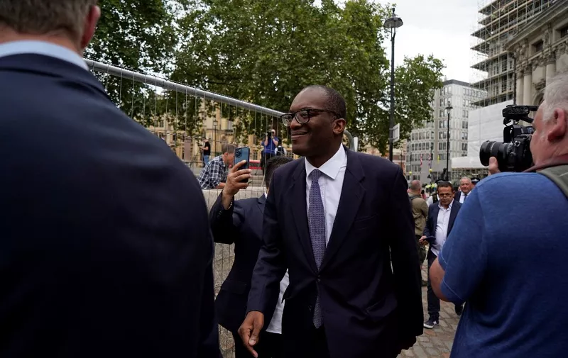 Britain's Business Secretary Kwasi Kwarteng (C) arrives at the Queen Elizabeth II centre ahead of an event to announce the winner of the Conservative Party leadership contest, and Britain's next prime minister, in central London on September 5, 2022. - The next British prime minister will be announced Monday with Liz Truss the favourite to succeed Boris Johnson and take charge as the nation battles a spiralling cost-of-living crisis. (Photo by Niklas HALLE'N / AFP)