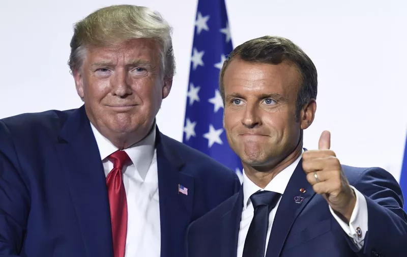 France's President Emmanuel Macron (R) and US President Donald Trump pose during a  joint press conference in Biarritz, south-west France on August 26, 2019, on the third day of the annual G7 Summit attended by the leaders of the world's seven richest democracies, Britain, Canada, France, Germany, Italy, Japan and the United States. (Photo by Bertrand GUAY / AFP)