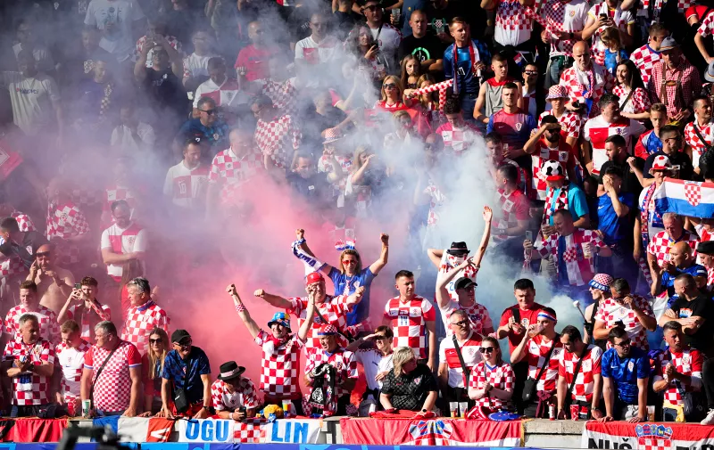 Croatian fans cheer ahead of a Group B match between Spain and Croatia at the Euro 2024 soccer tournament in Berlin, Germany, Saturday, June 15, 2024. (AP Photo/Petr Josek)