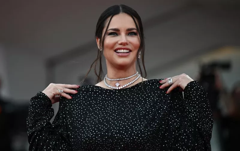 Adriana Lima poses during the red carpet of the movie "The Killer" presented in competion at the 80th Venice Film Festival on September 3, 2023 at Venice Lido. (Photo by Tiziana FABI / AFP)