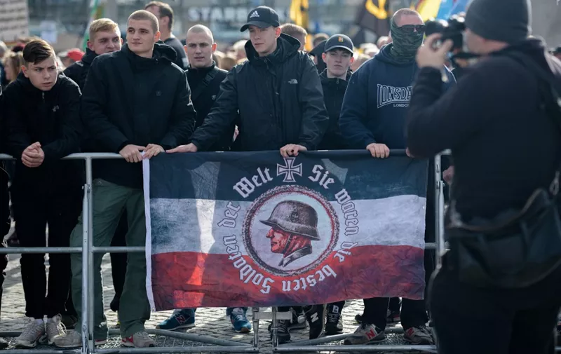 Supporters of the German right-wing movement PEGIDA (Patriotic Europeans Against the Islamisation of the Occident) attend a PEGIDA rally in Dresden, eastern Germany on October 17, 2021, marking its 7th anniversary. (Photo by AFP)