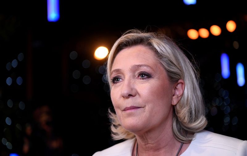French far-right Rassemblement National (RN) President and member of Parliament Marine Le Pen speaks to the press after the announcement of initial results during an RN election-night event for European parliamentary elections on May 26, 2019, at La Palmeraie venue in Paris. (Photo by Bertrand GUAY / AFP)