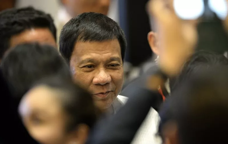 Philippine President Rodrigo Duterte arrives for the Association of Southeast Asian Nations (ASEAN) Business and Investment Summit in Vientiane on September 6, 2016.
The gathering will see the 10 ASEAN members meet by themselves, then with leaders from the US, Japan, South Korea and China.
 / AFP PHOTO / NOEL CELIS