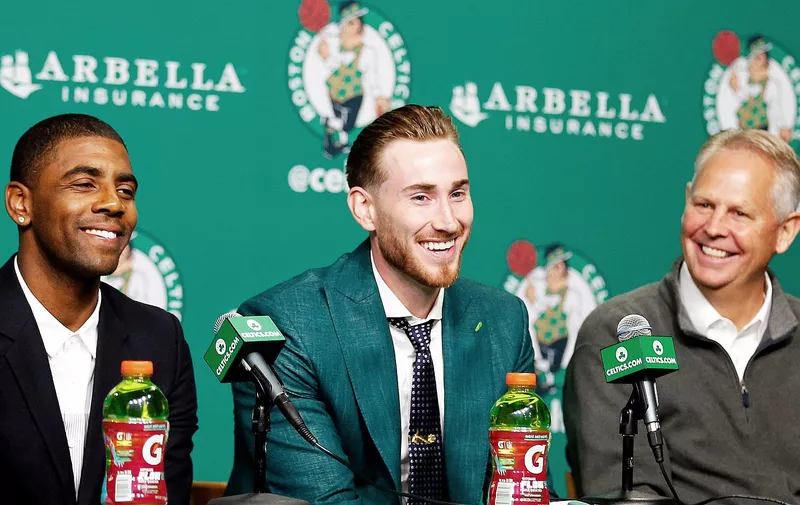 Boston Celtics&#8217; Kyrie Irving, left, Gordon Hayward and General Manager Danny Ainge, right, share a laugh during a news conference in Boston, Friday, Sept. 1, 2017. (AP Photo/Winslow Townson)