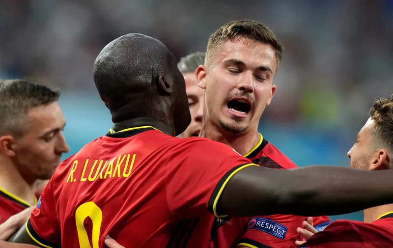Belgium's Romelu Lukaku celebrates with teammates after scoring his sides first goal during the Euro 2020 soccer championship group B match between Russia and Belgium at the Saint Petersburg stadium in St. Petersburg, Russia, Saturday, June 12, 2021. (AP Photo/Dmitry Lovetsky, Pool)