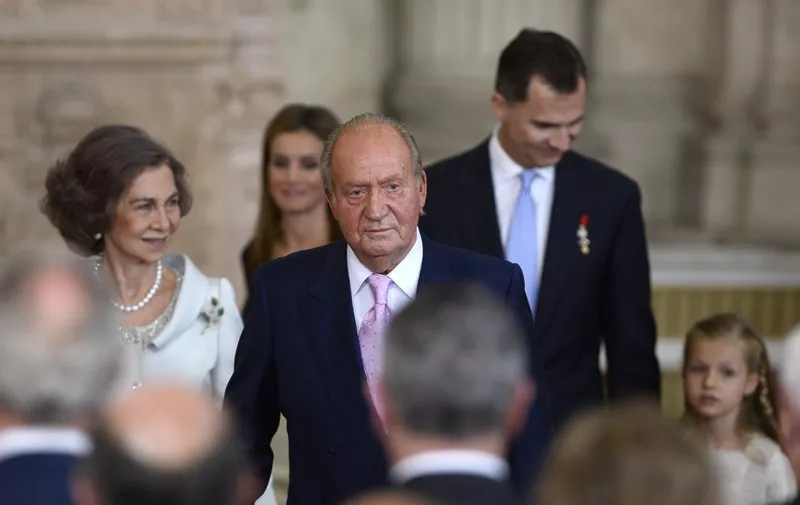 (L TO R) Spain's Queen Sofia, Spain's former King Juan Carlos and Spain's Crown Prince Felipe and Spanish Princess Leonor leave after the ceremony of approval and enactment of a law bringing into effect King Juan Carlo's abdication in the Columns Hall at the Royal Palace in Madrid on June 18, 2014. Spanish King Juan Carlos announced his abdication on June 2, 2014 in favour of his son Prince Felipe who tomorrow will swear an oath infront of both houses of parliament, ending a 39-year reign that guided Spain from dictatorship to democracy but was later battered by royal scandals. AFP PHOTO / GERARD JULIEN (Photo by GERARD JULIEN / AFP)