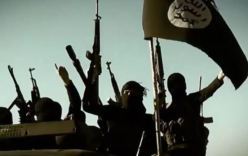 An image grab taken from a propaganda video released on March 17, 2014 by the Islamic State of Iraq and the Levant (ISIL)'s al-Furqan Media allegedly shows ISIL fighters raising their weapons as they stand on a vehicle mounted with the trademark Jihadists flag at an undisclosed location in the Anbar province. The jihadist Islamic State of Iraq and the Levant group has spearheaded a major offensive that began on June 9, 2014 and has since overrun all of Iraq's northern Nineveh province. AFP PHOTO / HO / AL-FURQAN MEDIA 
=== RESTRICTED TO EDITORIAL USE - MANDATORY CREDIT "AFP PHOTO / HO / AL-FURQAN MEDIA" - NO MARKETING NO ADVERTISING CAMPAIGNS - DISTRIBUTED AS A SERVICE TO CLIENTS FROM ALTERNATIVE SOURCES, AFP IS NOT RESPONSIBLE FOR ANY DIGITAL ALTERATIONS TO THE PICTURE'S EDITORIAL CONTENT, DATE AND LOCATION WHICH CANNOT BE INDEPENDENTLY VERIFIED ===