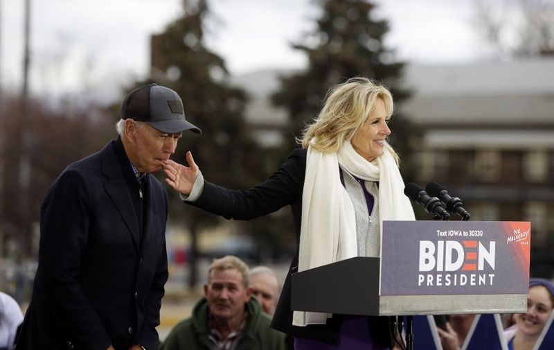 COUNCIL BLUFFS, IA - NOVEMBER 30: Democratic presidential candidate, former Vice President Joe Biden bites the finger of his wife Jill Biden as she introduces him during a campaign event on November 30, 2019 in Council Bluffs, Iowa. Biden, who begins his eight-day bus tour across Iowa on Saturday, once lead the state in the polls but now trails presidential candidates Pete Buttigieg and Elizabeth Warren with just under 3 months until the 2020 Iowa Democratic caucuses.   Joshua Lott/Getty Images/AFP