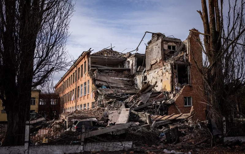 This photograph taken on March 4, 2022 shows a school building damaged in yesterday's shelling in the city of Chernihiv. - Fourty-seven people died on March 3 when Russian forces hit residential areas, including schools and a high-rise apartment building, in the northern Ukrainian city of Chernihiv, officials said. (Photo by Dimitar DILKOFF / AFP)