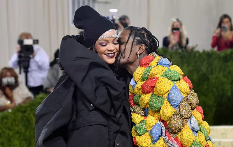 Barbadian singer Rihanna and US rapper A$AP Rocky arrive for the 2021 Met Gala at the Metropolitan Museum of Art on September 13, 2021 in New York. - This year's Met Gala has a distinctively youthful imprint, hosted by singer Billie Eilish, actor Timothee Chalamet, poet Amanda Gorman and tennis star Naomi Osaka, none of them older than 25. The 2021 theme is "In America: A Lexicon of Fashion." (Photo by ANGELA WEISS / AFP)