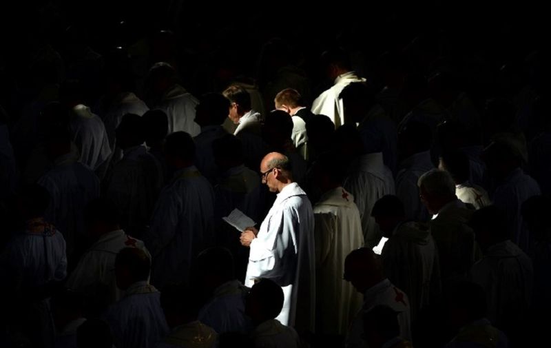 Priests take part at a mass held by Pope Francis at the Divine Mercy Sanctuary on July 30, 2016 in Krakow-Lagiewniki as part of the Catholic World Youth Days.
Pope Francis is in Poland for an international Catholic youth festival with a mission to encourage openness to migrants. / AFP PHOTO / FILIPPO MONTEFORTE