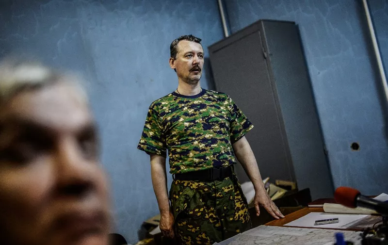Igor Strelkov, who is also known as Igor Girkin, the top military commander of the self-proclaimed "Donetsk People's Republic", delivers a press conference on July 28, 2014 in Donetsk, eastern Ukraine. Ukraine's army on July 28 seized control of part of the vast site where Malaysian airliner MH17 crashed, insurgents said, as the UN announced the downing of the plane could constitute a war crime. After explosions and fighting blocked a new attempt by Dutch and Australian police to access the east Ukraine crash site, Kiev confirmed that its forces were engaged in fierce clashes with rebels nearby. AFP PHOTO/ BULENT KILIC (Photo by Bulent KILIC / AFP)