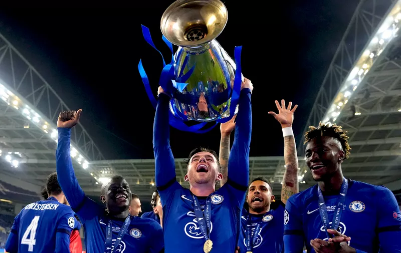 Chelsea's Ben Chilwell celebrates with the trophy after winning the Champions League final soccer match between Manchester City and Chelsea at the Dragao Stadium in Porto, Portugal, Saturday, May 29, 2021. (AP Photo/Manu Fernandez, Pool)