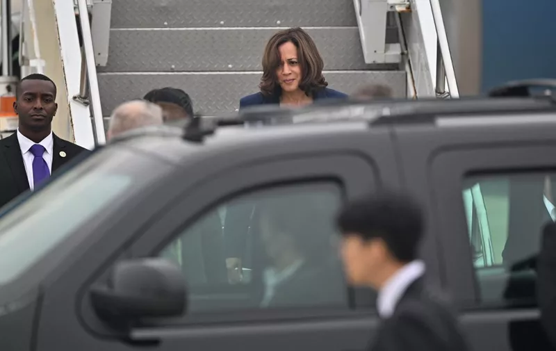 US Vice President Kamala Harris (C top) exits Air Force Two upon arriving at Osan Air Base in Pyeongtaek on September 29, 2022. (Photo by JUNG YEON-JE / POOL / AFP)