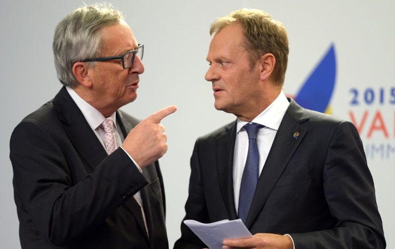 European Commission President Jean-Claude Juncker (L) speaks with European Council President Donald Tusk after a press conference following an Informal European Council meeting and a European Union - Africa Summit on Migration at the Mediterranean Conference Center, on November 12, 2015 in La Valletta. EU leaders attending a summit with their African counterparts today approved a 1.8-billion-euro trust fund for Africa aimed at tackling the root causes of mass migration to Europe.   AFP PHOTO / MATTHEW MIRABELLI  --- MALTA OUT
