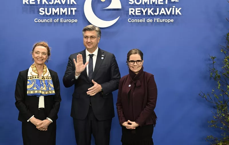 Croatia's Prime Minister Andrej Plenkovic (C) poses flanked by Secretary General of the Council of Europe Marija Pejcinovic Buric (L) and Iceland's Prime Minister Katrin Jakobsdottir upon his arrival for the 4th Summit of the Heads of State and Government of the Council of Europe, in Reykjavik, Iceland on May 16, 2023. Founded in 1949, the Council of Europe is the continents oldest pan-European organization and has a critical role to play as the regions guardian of human rights, democracy, and the rule of law. (Photo by Halldor KOLBEINS / AFP)